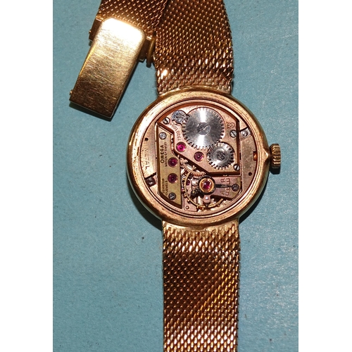 312 - Omega, a lady's 1950's 18ct gold-cased wrist watch, with signed silvered dial and gilt 3, 6, 9 and 1... 