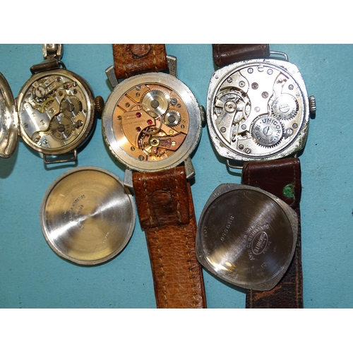 319 - An early-20th century lady's silver cased wristwatch, the case and movement marked Rolex, a gent's R... 