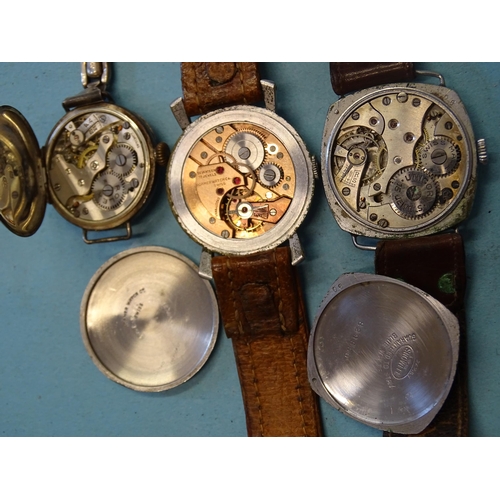 319 - An early-20th century lady's silver cased wristwatch, the case and movement marked Rolex, a gent's R... 