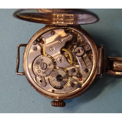 319 - An early-20th century lady's silver cased wristwatch, the case and movement marked Rolex, a gent's R... 