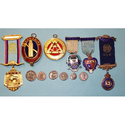 332 - Four silver-gilt Buffaloes and other Masonic jewels and coins.