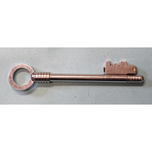 354 - Myon-cle, a French novelty lighter in the form of a key, 9.9cm long.