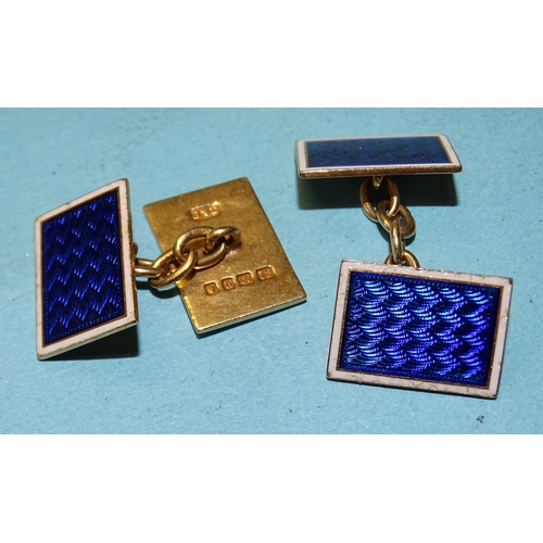 386 - A pair of 18ct gold cufflinks with blue and white guilloche enamel decoration, (scratched), 8g.... 