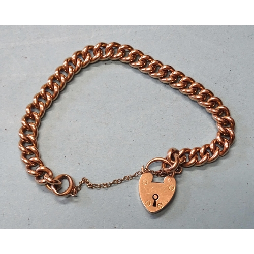 391 - A 15ct gold bracelet of solid curb links, with padlock clasp, 19cm long, 16.7g.