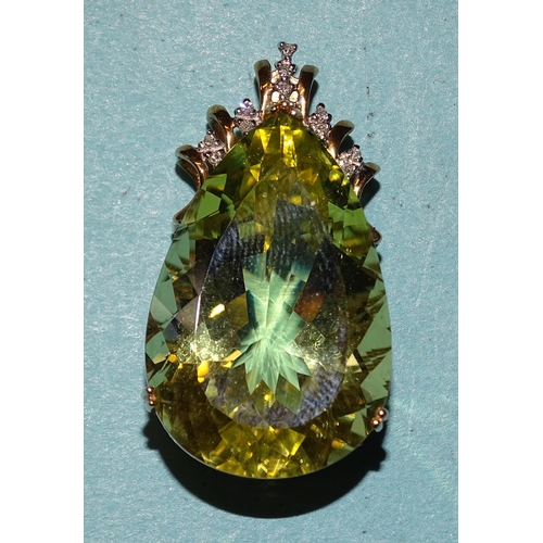 399 - A large pendeloque-cut yellow citrine in 9ct gold mount with diamond point accents, citrine 30 x 20 ... 