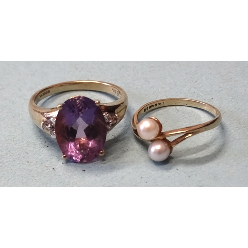 412 - A 9ct gold ring set an oval amethyst between diamond-set shoulders, (amethyst chipped), size O, 3.9g... 