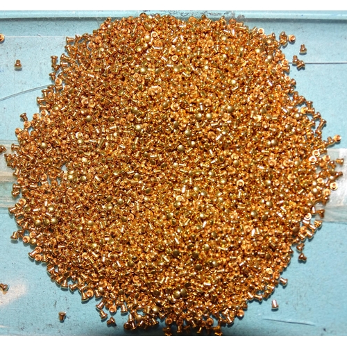 415 - A large quantity of gold plated rivets, each 1.5mm long, tests as 18ct gold approximately, 78.3g.... 