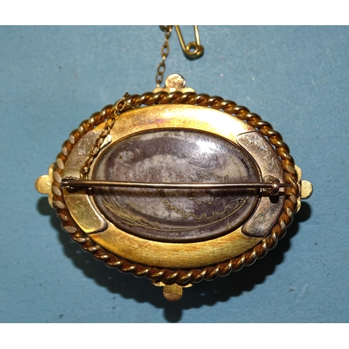 430 - A large Victorian gold mourning brooch set an oval banded-agate cabochon surmounted by a split-pearl... 