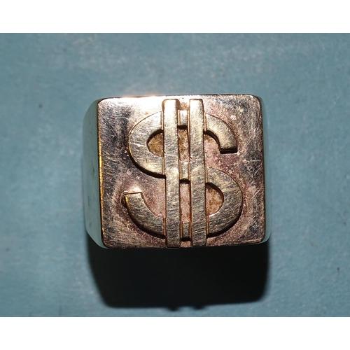 432 - A very large yellow gold ring with raised dollar sign, marked '9ct', size Z+, 62.9g.... 