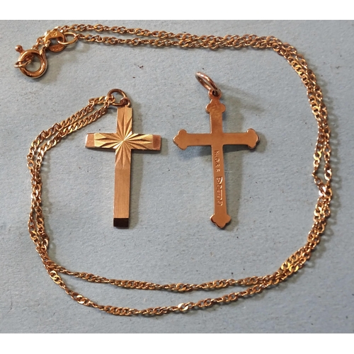 438 - A 9ct gold cross pendant on chain, 41cm and another 9ct gold cross, total weight 4.8g.... 