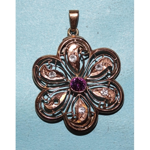 449 - A pendant of floral form set synthetic sapphires, unmarked, 31mm diameter, (altered from a brooch), ... 