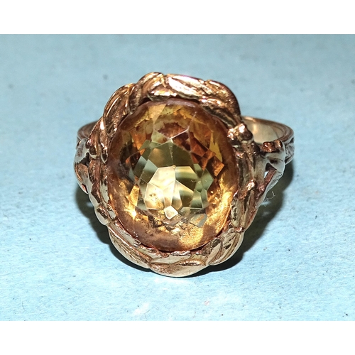 450 - A gold ring set an oval citrine within a wreath, on pierced and carved mount, size P, 6g, tested as ... 