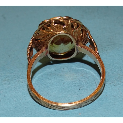 450 - A gold ring set an oval citrine within a wreath, on pierced and carved mount, size P, 6g, tested as ... 