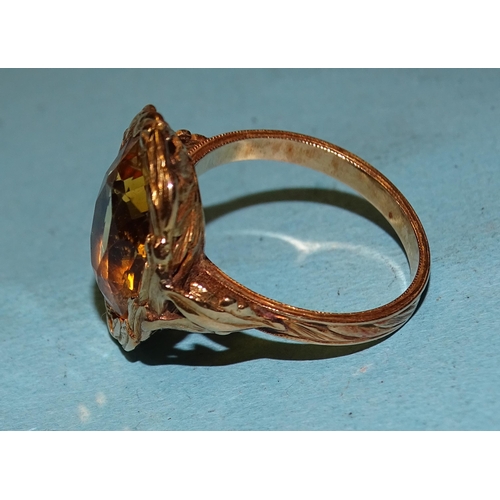 450 - A gold ring set an oval citrine within a wreath, on pierced and carved mount, size P, 6g, tested as ... 