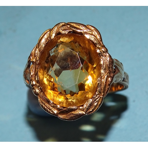 450 - A gold ring set an oval citrine within a wreath, on pierced and carved mount, size P, 6g, tested as ... 