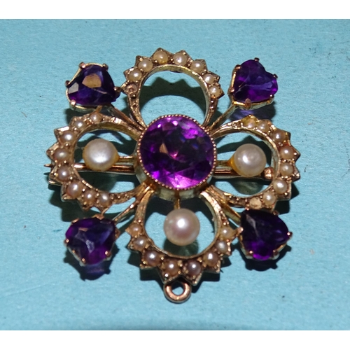 453 - An Edwardian 9ct gold brooch of quatrefoil form set amethysts and pearls, (one pearl and setting mis... 