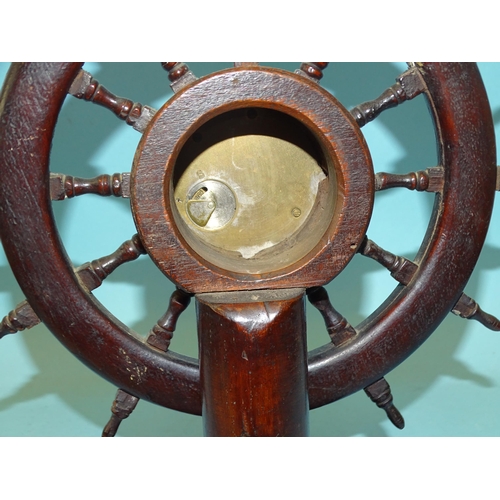 48 - A novelty table clock in the form of a twelve-spoke ship's wheel, now with central bezel wind moveme... 