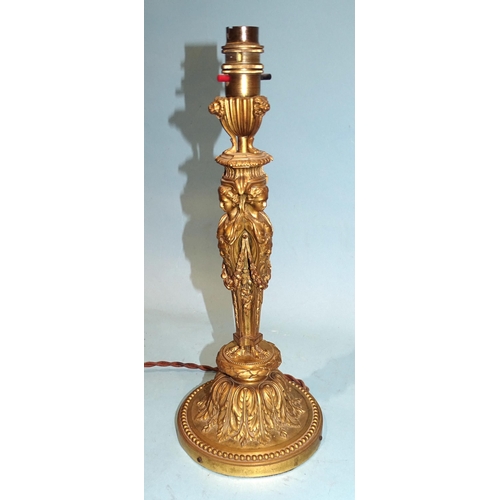 92 - An attractive ormolu table lamp in the form of three caryatids supporting a three-footed brazier, wi... 