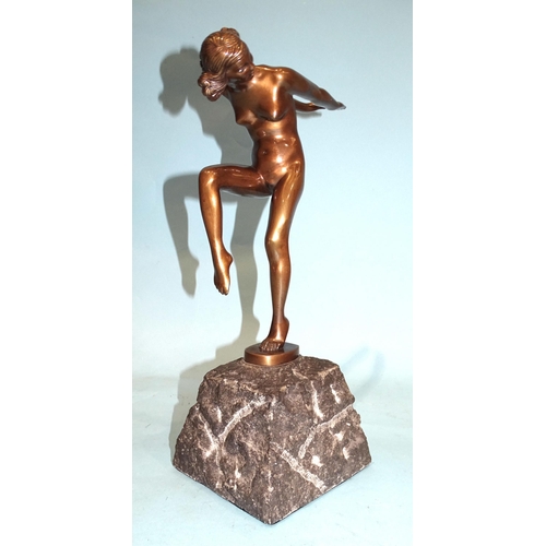 96 - A 1920's-style polished bronze nude female figure with arms stretched behind, raised on stone plinth... 