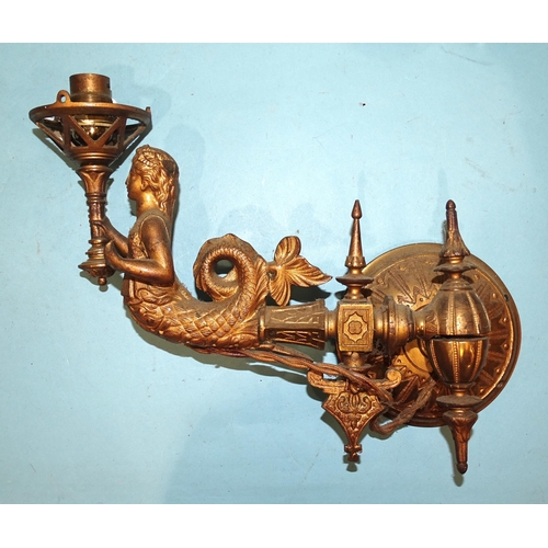 97 - Three gilt metal wall sconce light fittings, each in the form of a mermaid supporting a torch, exten... 