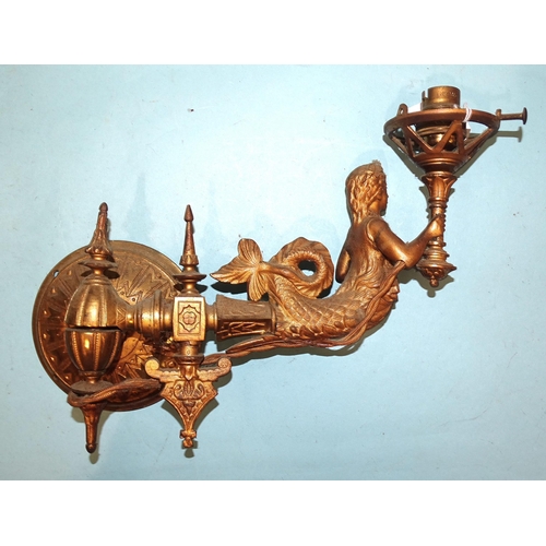 97 - Three gilt metal wall sconce light fittings, each in the form of a mermaid supporting a torch, exten... 