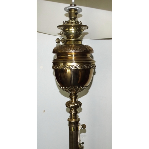 71 - An impressive antique brass adjustable oil lamp stand, the 