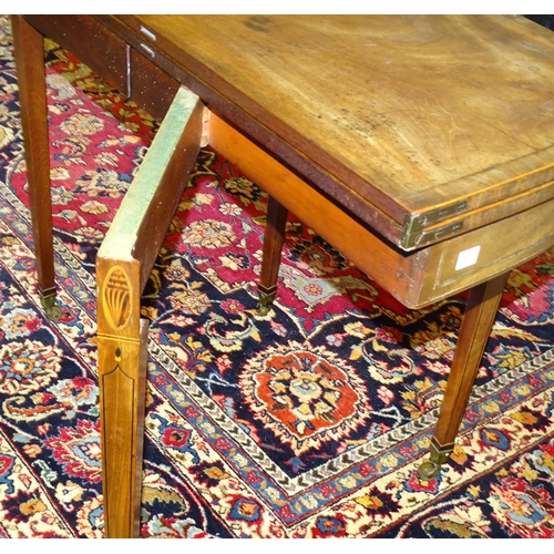 72 - A later-George-III inlaid and crossbanded mahogany fold-over tea table, on square tapered legs and c... 