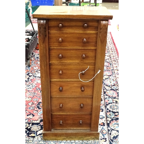 73 - A late-Victorian walnut Wellington chest fitted with seven drawers and locking bar, on plinth base, ... 