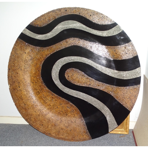 84 - A Jamaican unique circular wall sculpture formed from laminated cut bamboo canes, amongst black and ... 