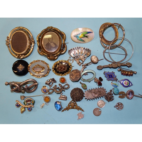 363 - Two Victorian hardstone brooches, (both cracked), two plated swivel brooches, a plated memorial broo... 