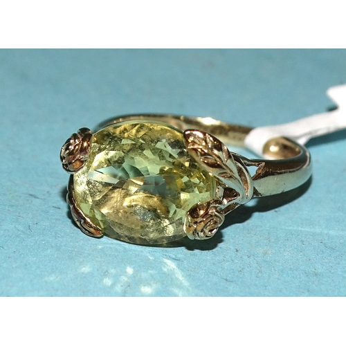 428 - A 9ct gold ring set oval citrine, in floral mount, size M½, 3.1g.