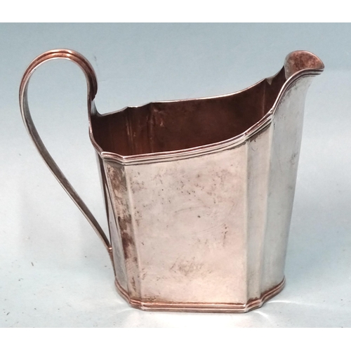 132 - A George III plain cream jug with reeded borders and C-scroll handle, 10cm high, London 1792, maker ... 