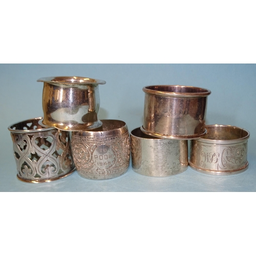 135 - A Russian 84-standard engraved and pierced napkin ring, three British silver napkin rings, various d... 