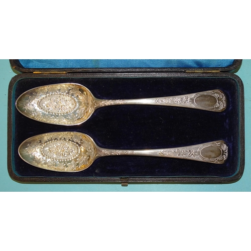 136 - A pair of 18th century silver spoons, the bowls with etched leaf and embossed floral decoration, 21c... 