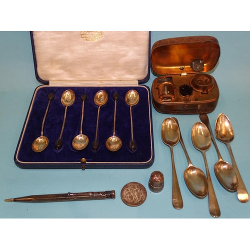 109 - A cased set of six silver coffee spoons with bean finials, Sheffield 1930, four silver rattail teasp... 