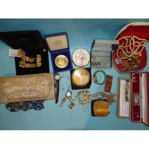 152 - A quantity of costume jewellery, compacts, a Bakelite manicure set and watches.