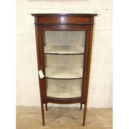 4 - An Edwardian inlaid mahogany bow-fronted display cabinet on tapered legs, 58cm wide, 133cm high.... 