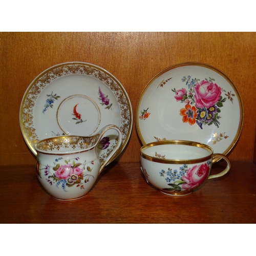 55 - A Marcolini Meissen cup and saucer decorated with floral sprays, (some wear to gilt rim) and a Berli... 