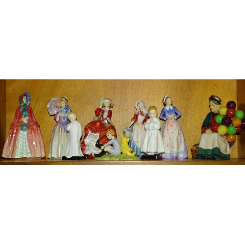 72 - A collection of eight Royal Doulton figurines comprising: 