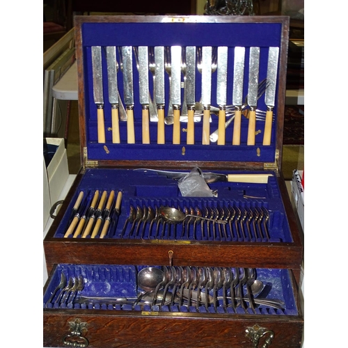 78 - A part canteen of plated cutlery contained in an oak case with hinged lid and single drawer, 50cm wi... 