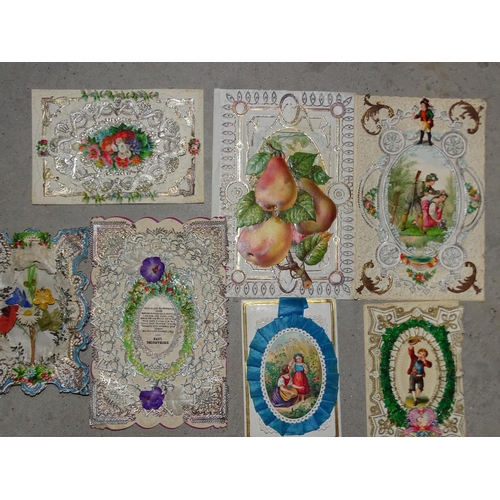 87 - A small collection of early 20th century Valentine cards, a schoolboy stamp collection, a pair ... 