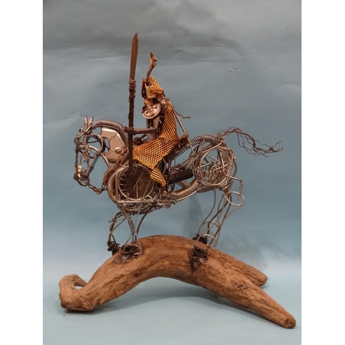 92 - A reclaimed metal sculpture of a mounted Japanese Samurai warrior mounted on a driftwood stand, 68cm... 