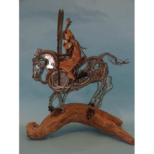 92 - A reclaimed metal sculpture of a mounted Japanese Samurai warrior mounted on a driftwood stand, 68cm... 