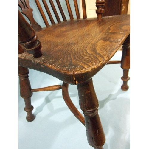 1 - A 19th century yew wood and elm-seated Windsor chair with solid seat, on turned legs with crinoline ... 