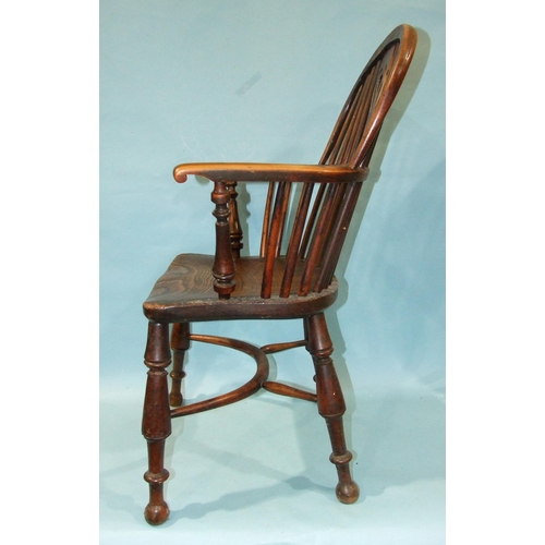 1 - A 19th century yew wood and elm-seated Windsor chair with solid seat, on turned legs with crinoline ... 