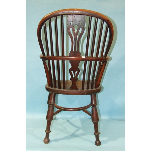 1 - A 19th century yew wood and elm-seated Windsor chair with solid seat, on turned legs with crinoline ... 