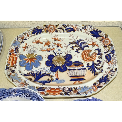 32 - A Masons Patent ironstone Imari-decorated meat plate depicting potted plant and shrubs, of octagonal... 