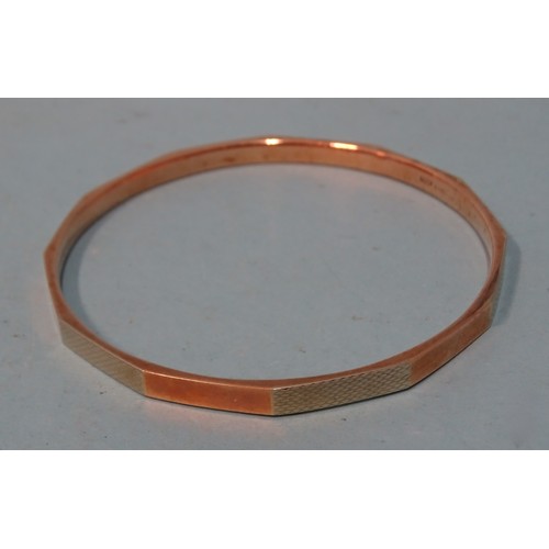 107 - A 9ct gold slave bangle, 7.3cm interior diameter, 9.3g.