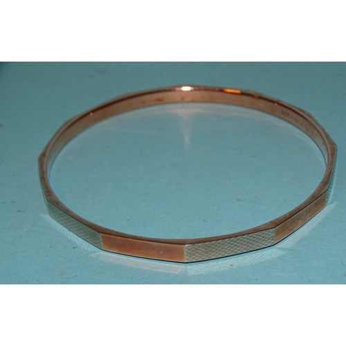 107 - A 9ct gold slave bangle, 7.3cm interior diameter, 9.3g.