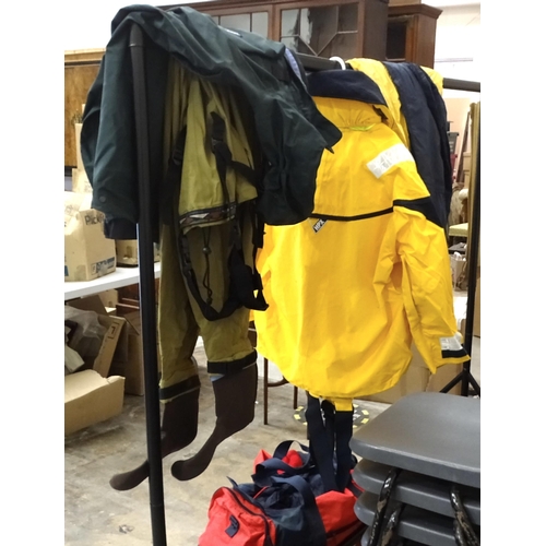 74 - A quantity of fishing clothing and equipment, including chest waders, Patagonia jacket, vacuum rod r... 